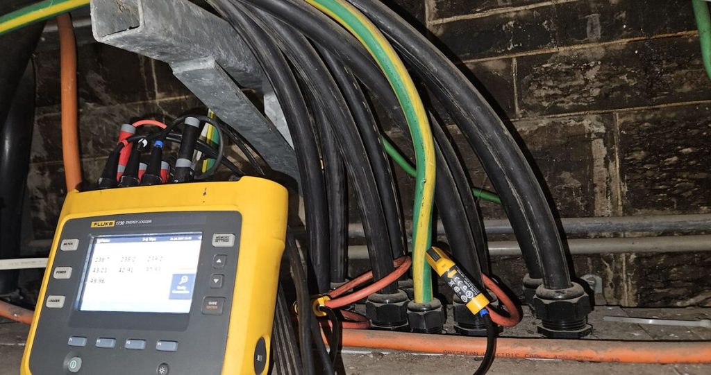 Fluke energy logger connected to switchboard cabling for power quality testing