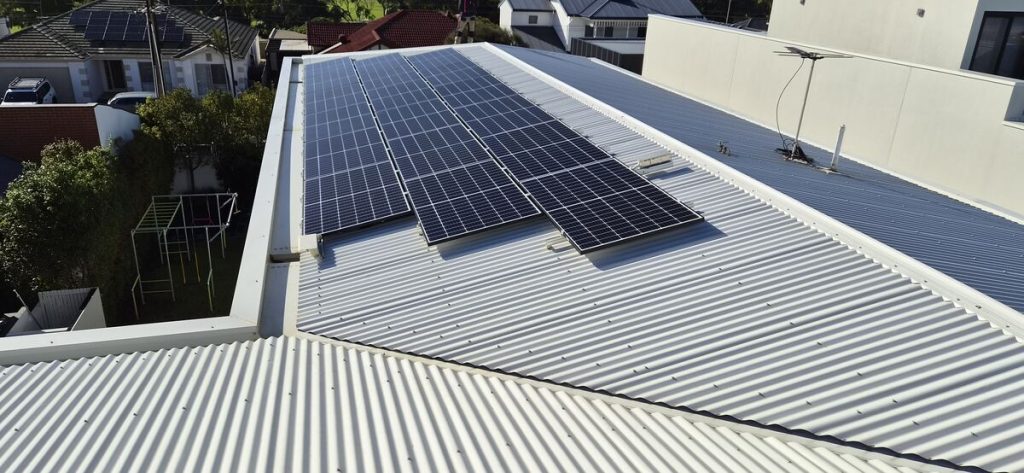Solar panels on a residential metal roof, aerial view